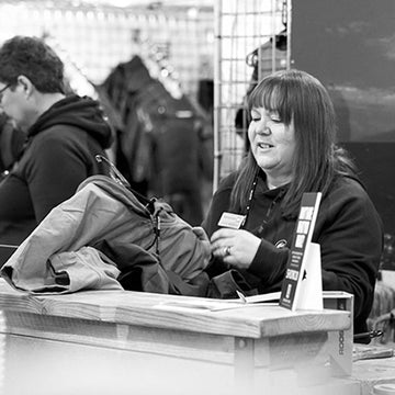 photo of Sue, warehouse coordinator working the till at a show